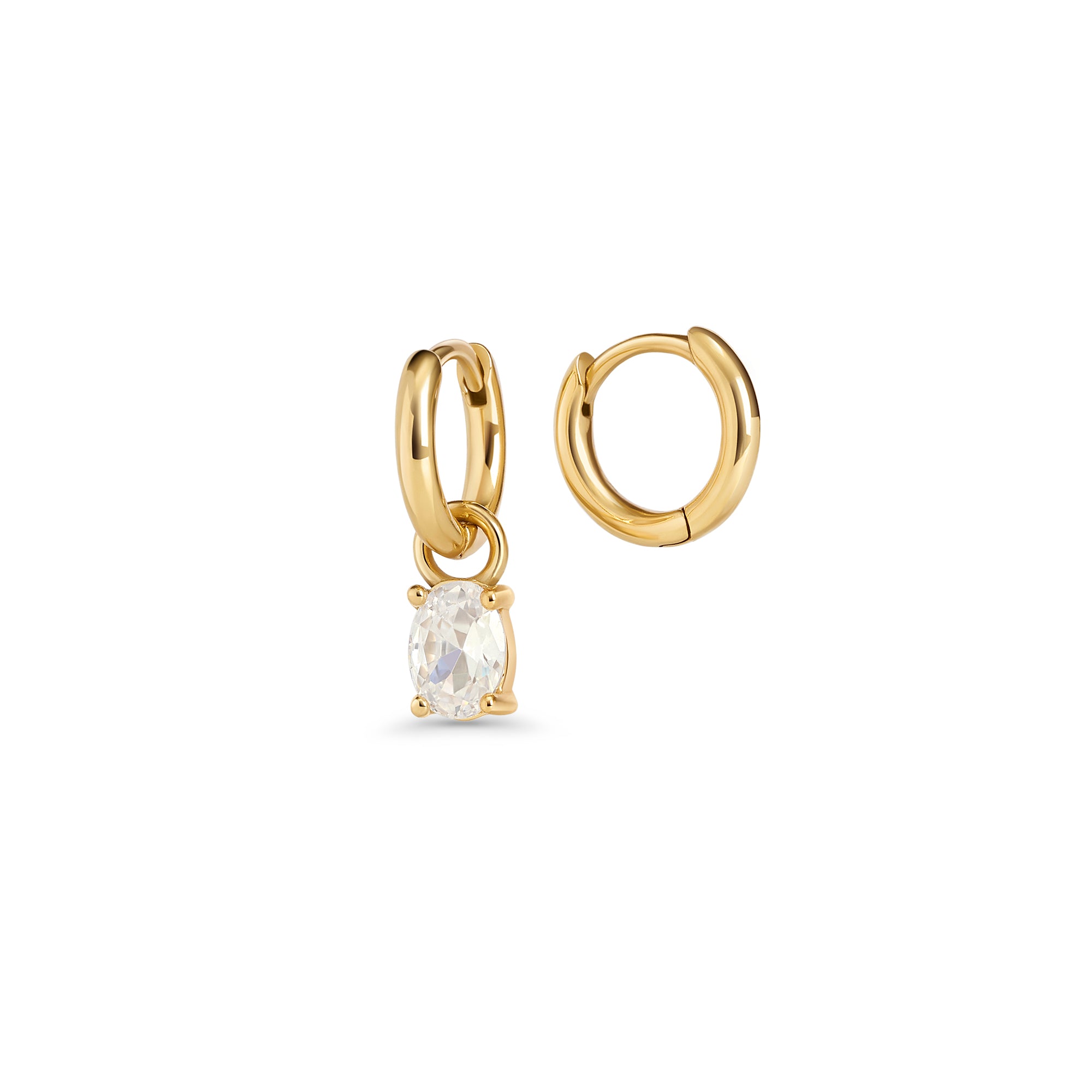 Gold hoop earrings with an oval clear stone pendant in a prong setting on a white background. 2-in-1. Jewelry by Mia Bijoux Canada.
Boucles d'oreilles anneaux dorées avec pendentif serti sur griffes d'une pierre transparente ovale sur fond blanc. 2-in-1. Bijoux par Mia Bijoux Canada.