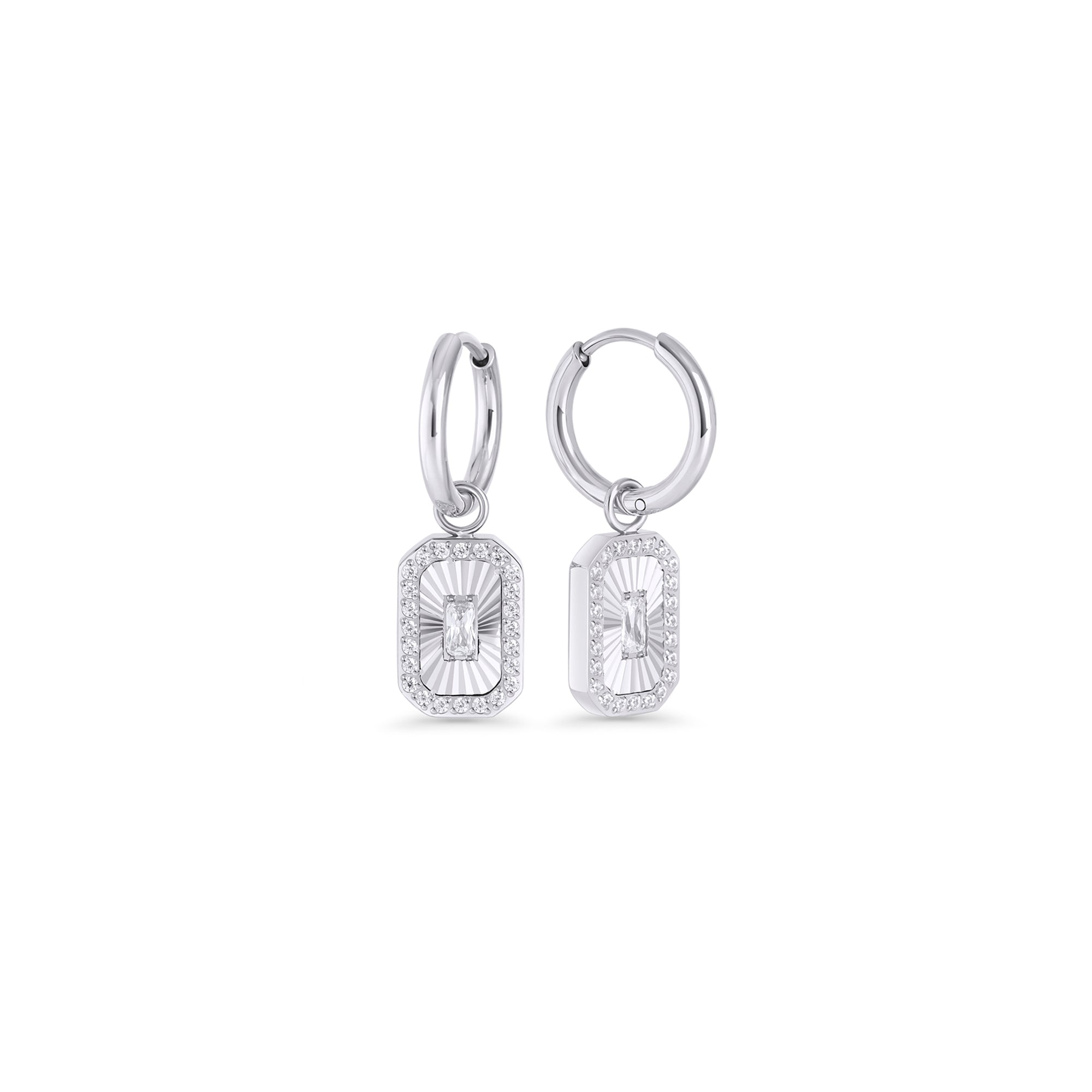 Silver hoop earrings with a rectangular octagonal pendant featuring a fluted sunburst center and baguette cubic zirconia on a white background. Nickel-free and waterproof jewelry by Mia Bijoux Canada.
Boucles d'oreilles anneaux argentées avec pendentif rectangulaire octogonal à motif rayonnant strié et zircon taille baguette sur fond blanc. Bijoux sans nickel et résistants à l'eau par Mia Bijoux Canada.