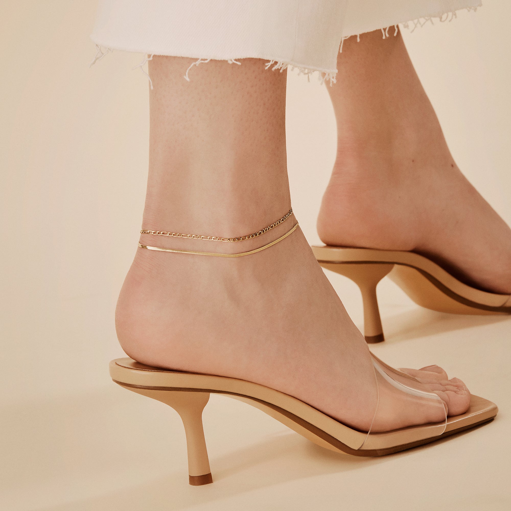 gold flat and figaro ankle chains stacking