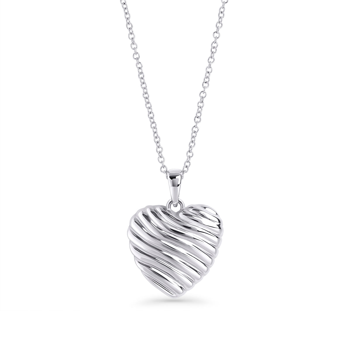 Silver stainless steel ribbed heart pendant necklace close-up, sculptural romantic jewelry design, hypoallergenic non-tarnish durable statement necklace, modern elegant heart jewelry.
